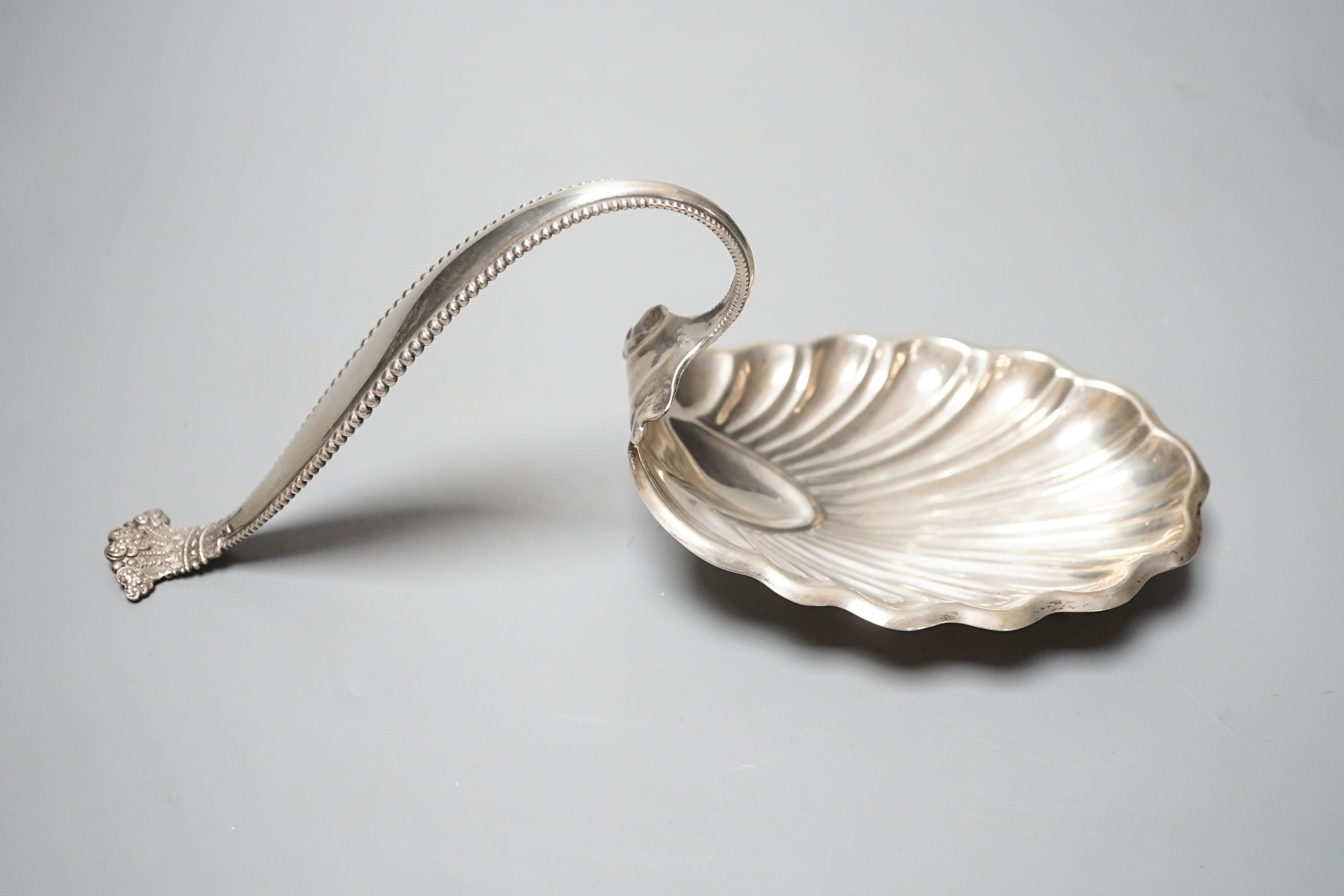 A sterling spoon shaped shell dish, by George W Schleiber & Co, 26.5cm, 6oz.